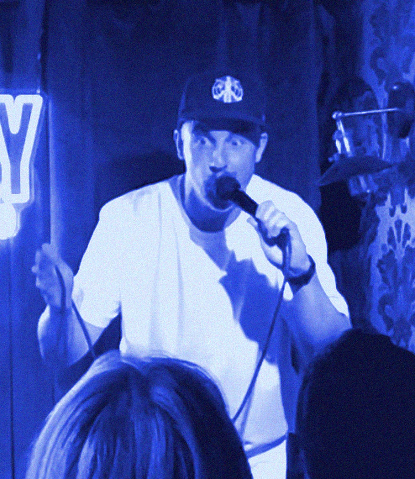 David William Bryan on stage at the Comedy Cellar